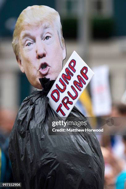 Dump trump' sign is seen as protestors gather outside Cardiff Library on the Hayes in Cardiff to protest against a visit by the President of the...