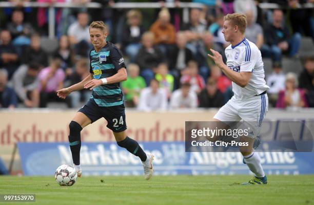 Palko Dardai of Hertha BSC and Dominik Horstmann of MSV Neuruppin during the game between MSV Neuruppin against Hertha BSC at the Volkspar-Stadion on...