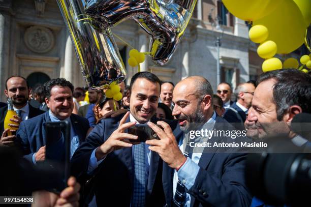 Deputy Prime Minister Luigi di Maio, Gianluigi Paragone , Senators and Deputies of 5-Star movement celebrate after that the Italian Parliament...