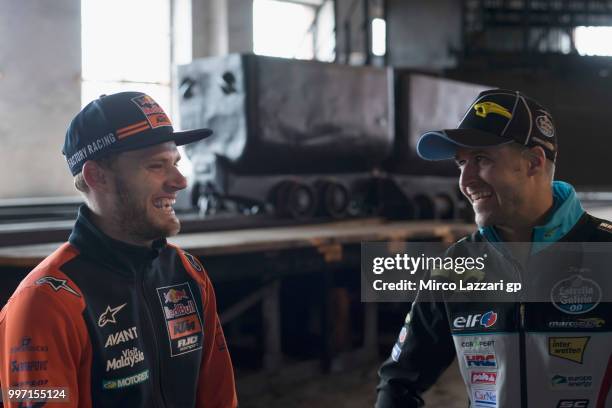 Brad Binder of South Africa and Red Bull KTM Ajo smiles with Tom Luthi of Switzerland and and Team EG 0,0 Marc VDS during the pre-event "MotoGP...