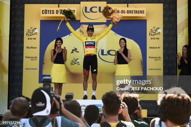 Belgium's Greg Van Avermaet, wearing the overall leader's yellow jersey, celebrates on the podium after the sixth stage of the 105th edition of the...