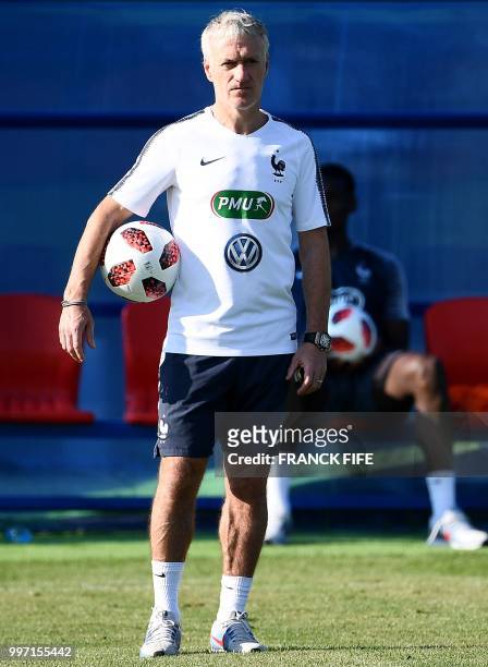France's head coach Didier Deschamps looks on during a training session at the Glebovets stadium in Istra, some 70 km west of Moscow on July 12 ahead...