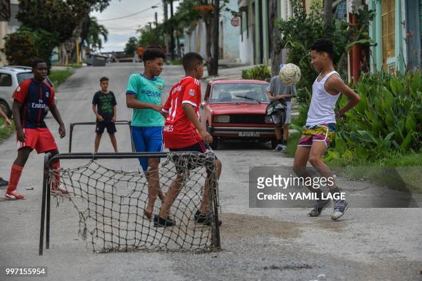 Cuban boys play football on a street in Havana, on July 12 three days ahead of the FIFA World Cup final match between France and Croatia in Russia.