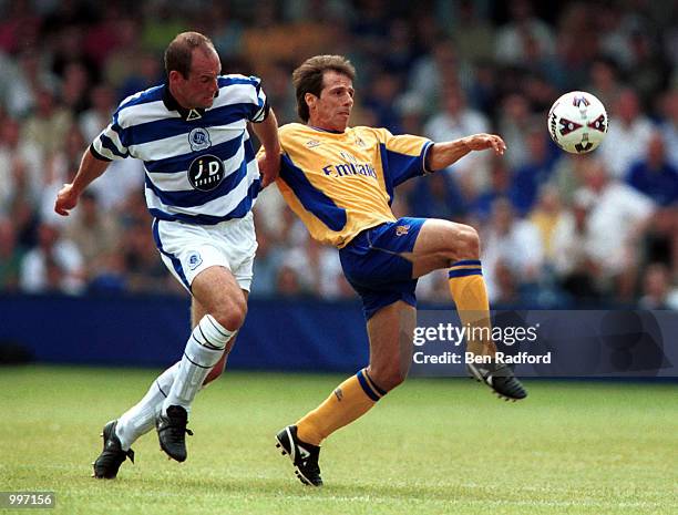 Gianfranco Zola of Chelsea holds off the challenge of Steve Palmer of QPR during the pre-season friendly match between Queens Park Rangers and...