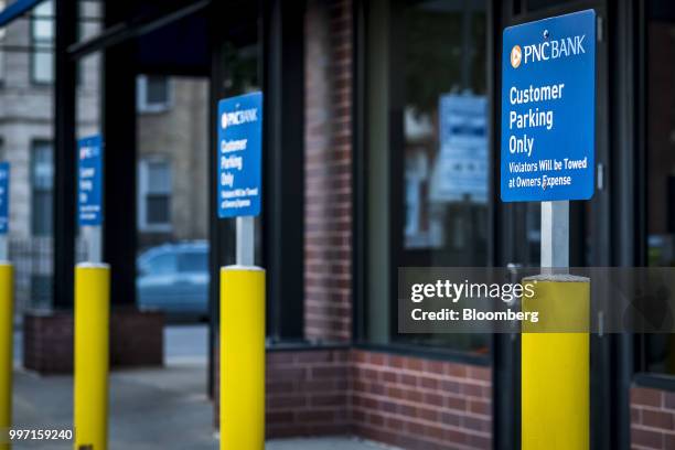 Customer Parking Only" sign stands on display outside a PNC Financial Services Group Inc. Bank branch in Chicago, Illinois, U.S., on Thursday, July...