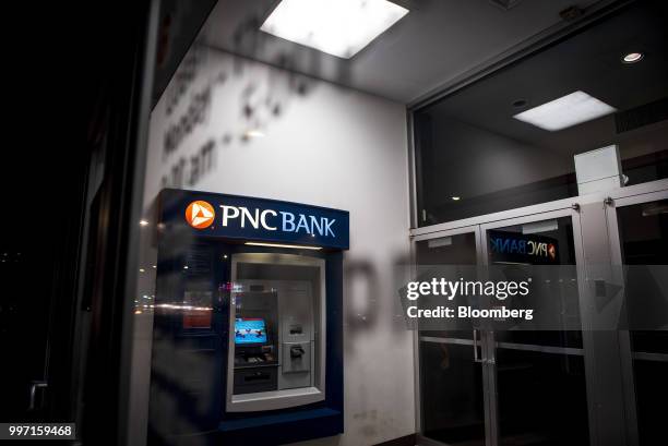 An automatic teller machine stands inside a PNC Financial Services Group Inc. Bank branch at night in Chicago, Illinois, U.S., on Tuesday, July 10,...