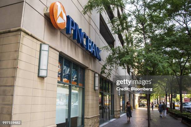 Pedestrians pass in front of a PNC Financial Services Group Inc. Bank branch in Chicago, Illinois, U.S., on Wednesday, July 11, 2018. PNC Financial...