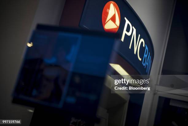 Signage is displayed on an automatic teller machine at a PNC Financial Services Group Inc. Bank branch in Chicago, Illinois, U.S., on Tuesday, July...
