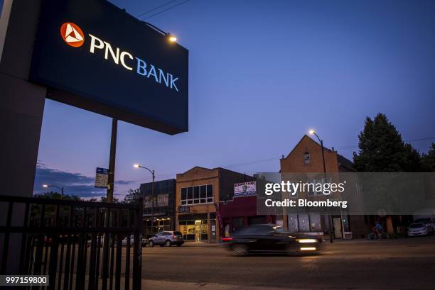 Vehicle passes in front of a PNC Financial Services Group Inc. Bank branch in Chicago, Illinois, U.S., on Tuesday, July 10, 2018. PNC Financial...