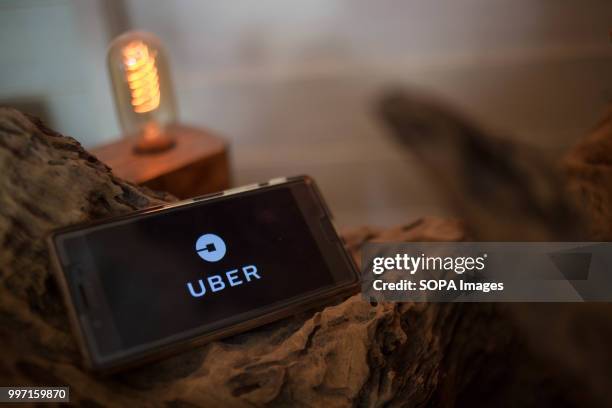 In this photo illustration, the Uber application seen displayed on a Sony smartphone.