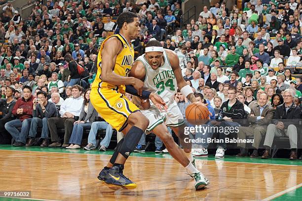 Paul Pierce of the Boston Celtics drives the lane against Danny Granger of the Indiana Pacers on March 12, 2010 at the TD Garden in Boston,...