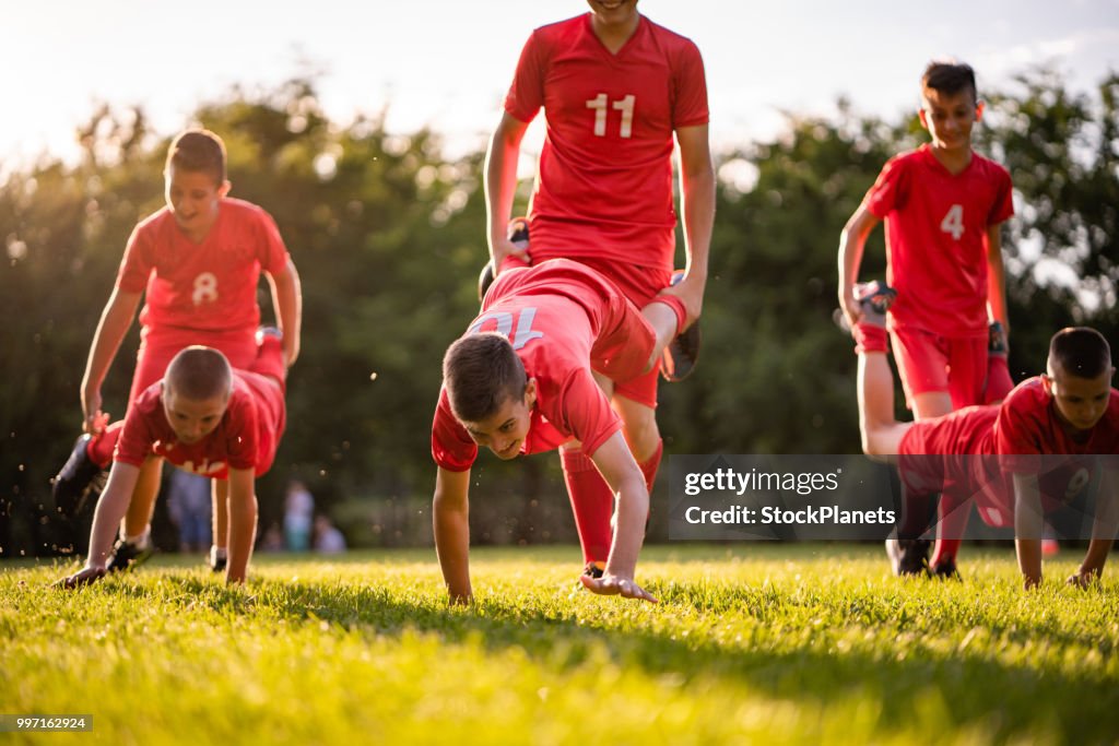 Soccer players enjoying together in the field