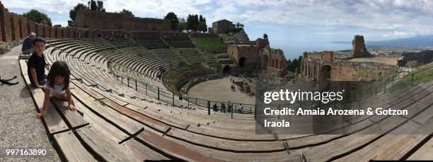 two brothers in the greek theater of taormina - teatro greco taormina bildbanksfoton och bilder