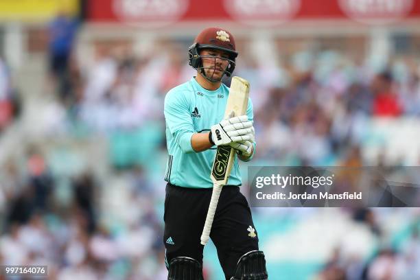 Rory Burns of Surrey reacts as he walks off the field after being dismissed by Matt Coles of Essex during the Vitality Blast match between Surrey and...