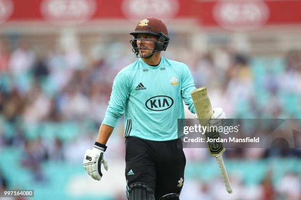 Rory Burns of Surrey reacts as he walks off the field after being dismissed by Matt Coles of Essex during the Vitality Blast match between Surrey and...