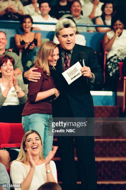 Episode 1663 -- Pictured: An audience member with host Jay Leno during a segment on August 13, 1999 --