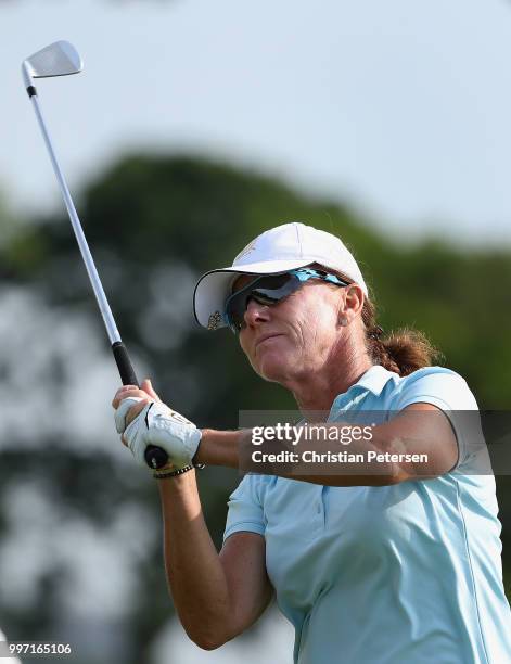 Helen Alfredsson of Sweden plays a tee shot on the seventh hole during the first round of the U.S. Senior Women's Open at Chicago Golf Club on July...