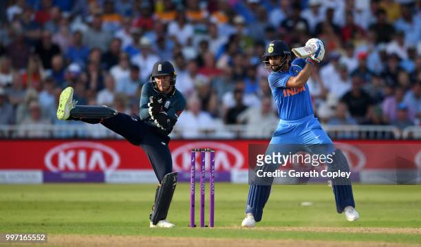 Virat Kohli of India bats watched by Englamd wicketkeeper Jos Buttler during the Royal London One-Day match between England and India at Trent Bridge...