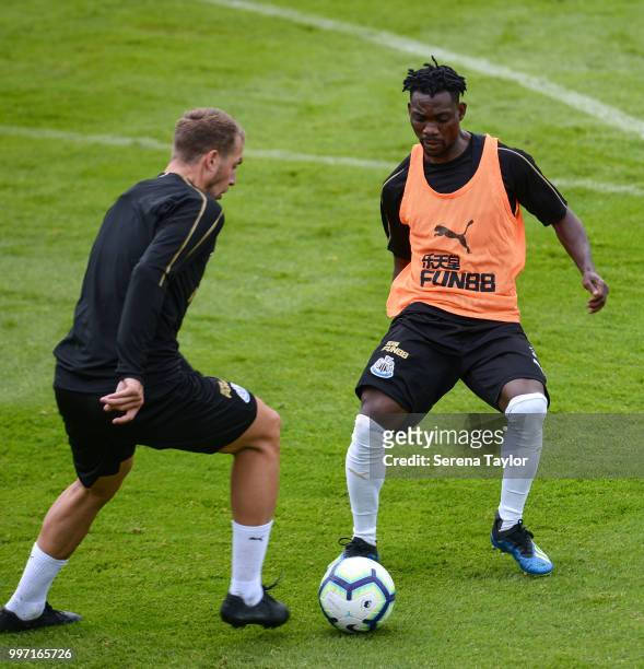 Christian Atsu and Florian Lejeune run towards the ball during the Newcastle United Training session at Carton House on July 12 in Kildare, Ireland.