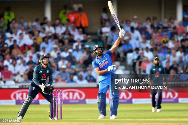 India's Rohit Sharma hits a six during the One Day International cricket match between England and India at Trent Bridge in Nottingham central...