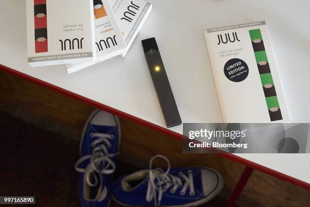 Juul Labs Inc. E-cigarette and flavored pods are arranged for a photograph in the Brooklyn Borough of New York, U.S., on Sunday July 8, 2018. Juul...