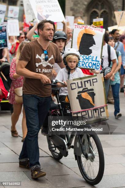 Anti-Donald Trump protesters gather on the Hayes in Cardiff to protest against a visit by U.S. President Donald Trump on July 12, 2018 in Cardiff,...