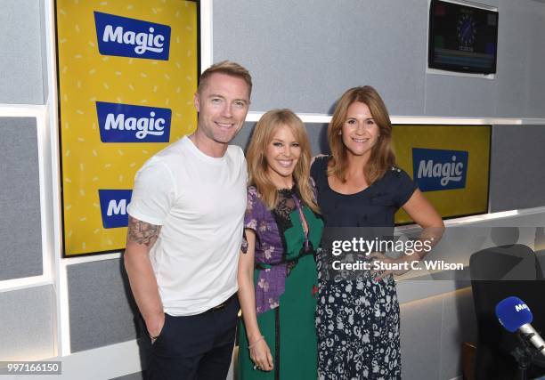 Kylie Minogue poses with Ronan Keating and Harriet Scott during a visit to Magic Radio on July 11, 2018 in London, England.