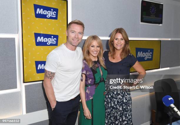 Kylie Minogue poses with Ronan Keating and Harriet Scott during a visit to Magic Radio on July 11, 2018 in London, England.