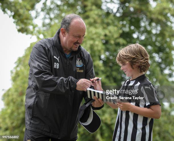 Rafael Benitez signs an autograph for a fan during the Newcastle United Training session at Carton House on July 12 in Kildare, Ireland.