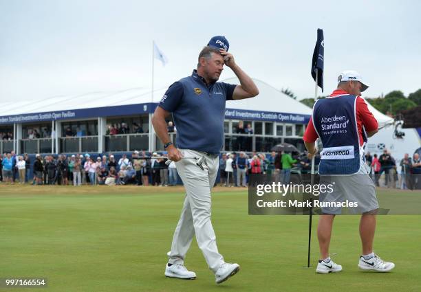 Lee Westwood of England finishes his round at the 18th green during the first day of the Aberdeen Standard Investments Scottish Open at Gullane Golf...