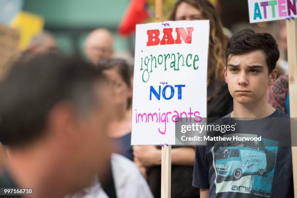 Anti-Donald Trump signs are seen as protesters gather outside Cardiff Library on the Hayes in Cardiff to protest against a visit by U.S. President...