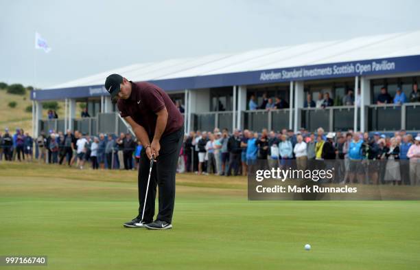 Patrick Reed of USA putts at the 18th green during the first day of the Aberdeen Standard Investments Scottish Open at Gullane Golf Course on July...