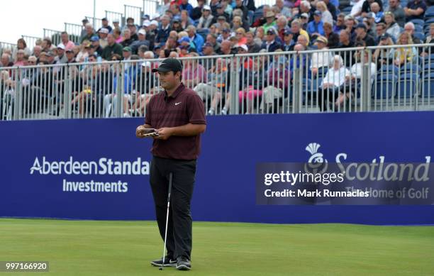 Patrick Reed of USA looks on at the 18th green during the first day of the Aberdeen Standard Investments Scottish Open at Gullane Golf Course on July...