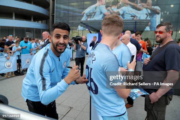 New Manchester City signing Riyad Mahrez greets and signs autographs for fans at the Etihad Stadium, Manchester.