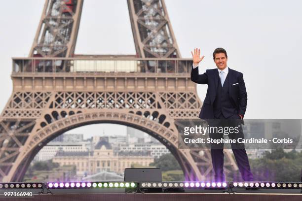 Actor Tom Cruise poses in front of the Eiffel Tower during the 'Mission: Impossible - Fallout' Global Premiere in Paris on July 12, 2018 in Paris,...