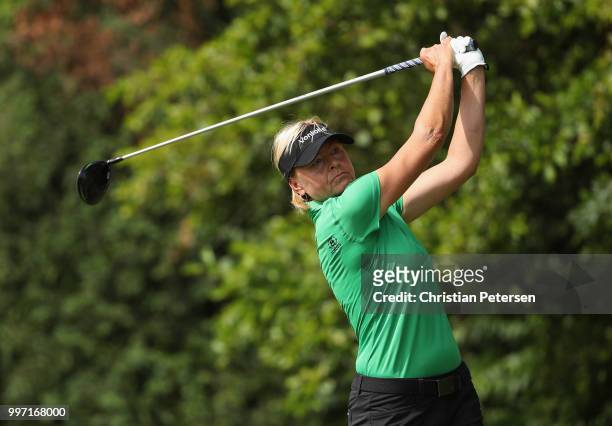Liselotte Neumann of Sweden plays a tee shot on the eighth hole during the first round of the U.S. Senior Women's Open at Chicago Golf Club on July...