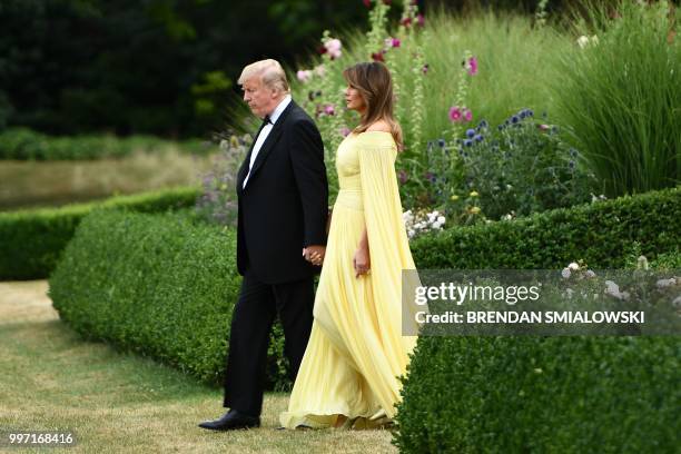 President Donald Trump and US First Lady Melania Trump leave the US ambassador's residence, Winfield House, in London on July 12 heading to Blenheim...