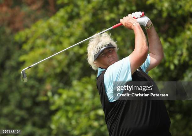 Laura Davies of England plays a tee shot on the eighth hole during the first round of the U.S. Senior Women's Open at Chicago Golf Club on July 12,...