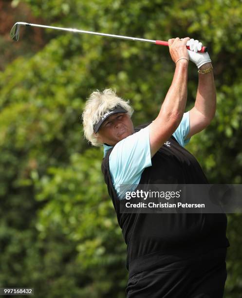 Laura Davies of England plays a tee shot on the eighth hole during the first round of the U.S. Senior Women's Open at Chicago Golf Club on July 12,...