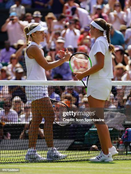 Angelique Kerber and Jelena Ostapenko shake hands at the net after Kerber defeated Ostapenko after their women's singles semi-final of the 2018...