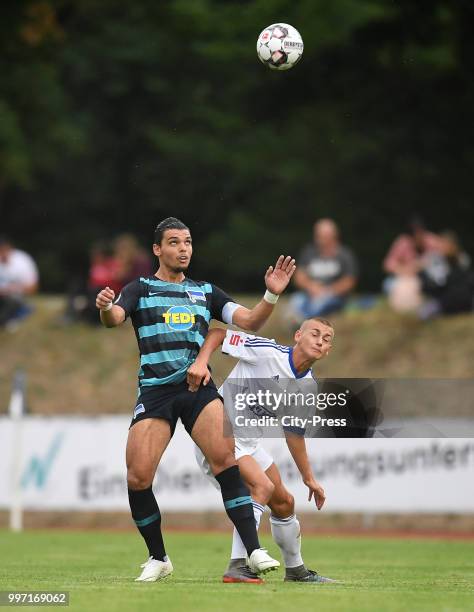 Karim Rekik of Hertha BSC and Philipp Mueller of MSV Neuruppin during the game between MSV Neuruppin against Hertha BSC at the Volkspar-Stadion on...