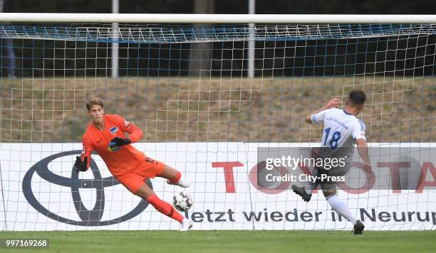 Kevin Blumenthal of MSV Neuruppin scores the 1:6 against Dennis Smarsch of Hertha BSC during the game between MSV Neuruppin against Hertha BSC at the...