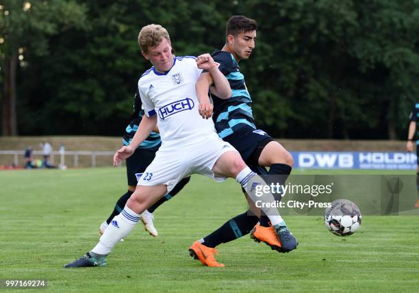 Soeren Grashoff of MSV Neuruppin and Muhammed Kiprit of Hertha BSC during the game between MSV Neuruppin against Hertha BSC at the Volkspar-Stadion...