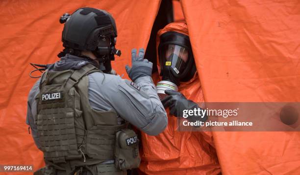 Heavily weaponized police officers can be seen during a police exercise for terror attacks with bio weaponry in Berlin, Germany, 11 October 2017....