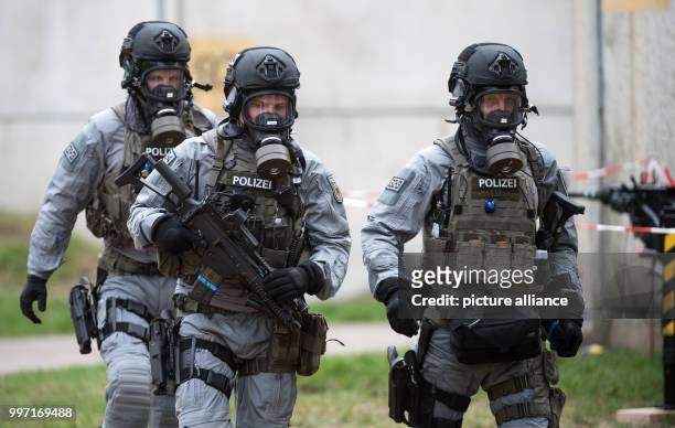 Heavily weaponized police officers can be seen during a police exercise for terror attacks with bio weaponry in Berlin, Germany, 11 October 2017....