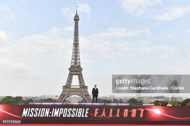 Actor Tom Cruise poses in front of the Eiffel Tower during the 'Mission: Impossible - Fallout' Global Premiere in Paris on July 12, 2018 in Paris,...