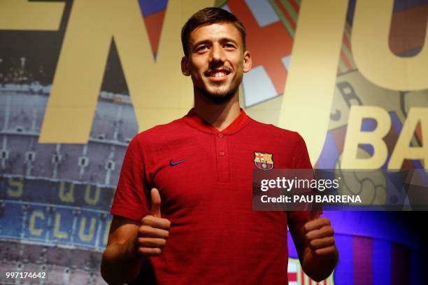 Barcelona´s new player French defender Clement Lenglet poses at the Camp Nou stadium in Barcelona on July 12, 2018. - Clement Lenglet will join up...