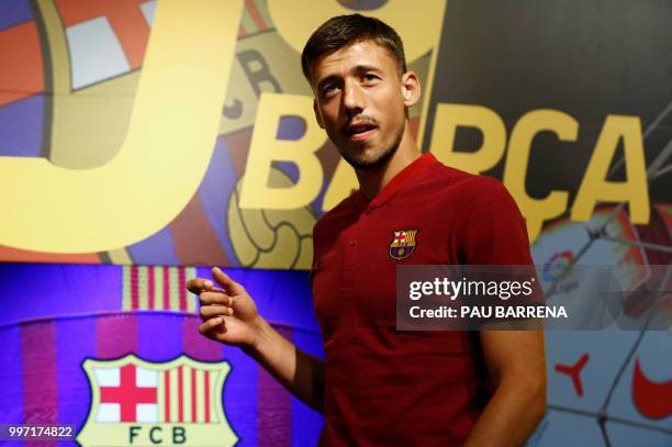 Barcelona´s new player French defender Clement Lenglet poses at the Camp Nou stadium in Barcelona on July 12, 2018. - Clement Lenglet will join up...