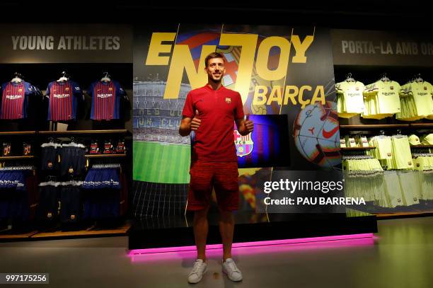 Barcelona´s new player French defender Clement Lenglet poses at the Camp Nou stadium in Barcelona on July 12, 2018. - Clement Lenglet will join up...