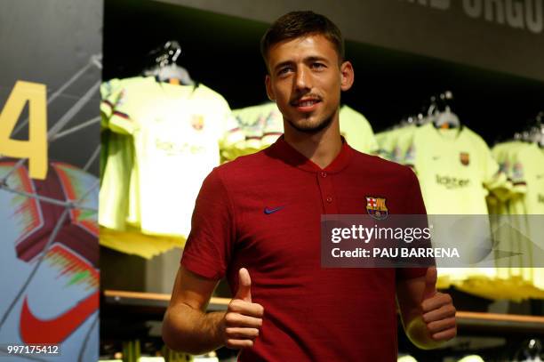 Barcelona´s new player French defender Clement Lenglet poses at the Camp Nou stadium in Barcelona on July 12, 2018. - Clement Lenglet will join up...